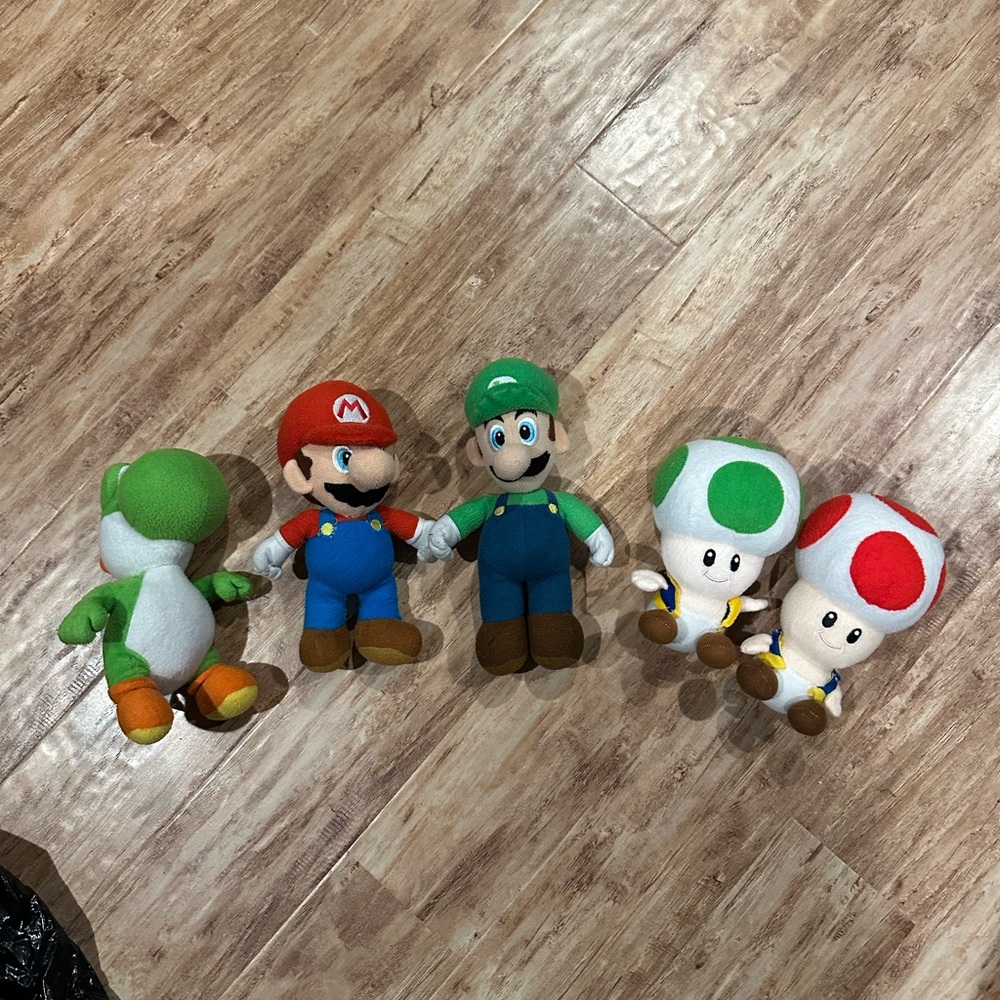 Nintendo Super Mario Bros plush toy set featuring Yoshi, Mario, Luigi and Toads
